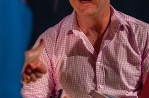 Glen Humphries signs copies of his new book. Photo by Greg Jackson. 