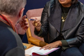 Indira Naidoo signs copies of her novel. Photo by Greg Jackson. 
