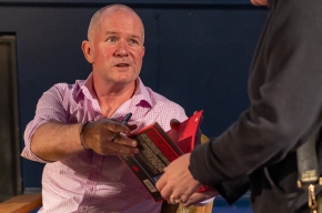 Glen Humphries signs copies of his new book. Photo by Greg Jackson. 