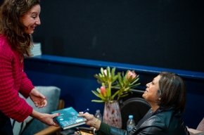 Indira Naidoo signs copies of her novel. Photo by Greg Jackson. 