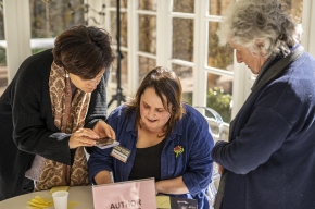 Nadine Ingram signs copies of her latest cookbook, Flour and Stone. Photo by Greg Jackson. 