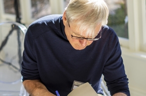 J.R. Lonie signs copies of his latest book, The Woman from Saint Germain. Photo by Greg Jackson. 