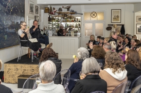 With a glass of Todd's wine in hand, Sue Turnbull interviews Todd Alexander about his latest book, Thirty Thousand Bottles of Wine and a Pig Called Helga. Photo by Greg Jackson.