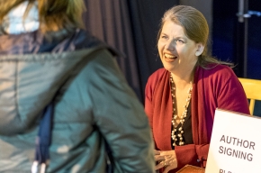 Meg Keneally signs copies of her books from The Monsarrat Series. Photo by Greg Jackson.