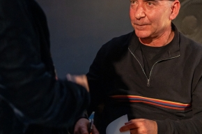 Mark Dapin signs copies of his new book. Photo by Greg Jackson. 